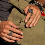 Guy Wearing King Baby Rings and Bracelets