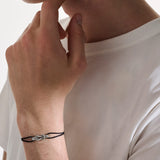 Model Wearing John Hardy Mens Silver Manah Knot Extra Thin Width Black Cord Bracelet