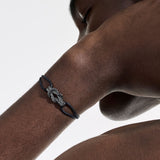 Model Wearing John Hardy Mens Rhodium Manah Knot Thin Width Black Cord Bracelet