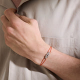 Model Wearing John Hardy Mens Diamond Silver Manah Knot Thin Width Orange Cord Bracelet