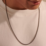 Model Wearing Thin Width Box Link Chain in Black Rhodium Silver by John Hardy