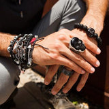 Guy Wearing Skull Rings and Bracelets