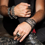 Guy Wearing Multiple King Baby Bracelets